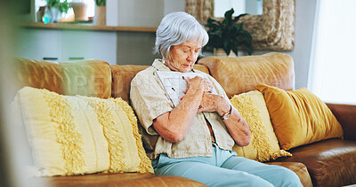 Buy stock photo Senior, woman or sad for memory of photo on sofa with grief, reflection or hug frame with sorrow or nostalgia. Elderly person, picture or mourning in home with depression, mental health or heartbreak