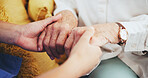 Nurse, senior person and holding hands on sofa with care, empathy or support with mental health for grief. People, caregiver and elderly patient for connection, kindness or counseling in nursing home