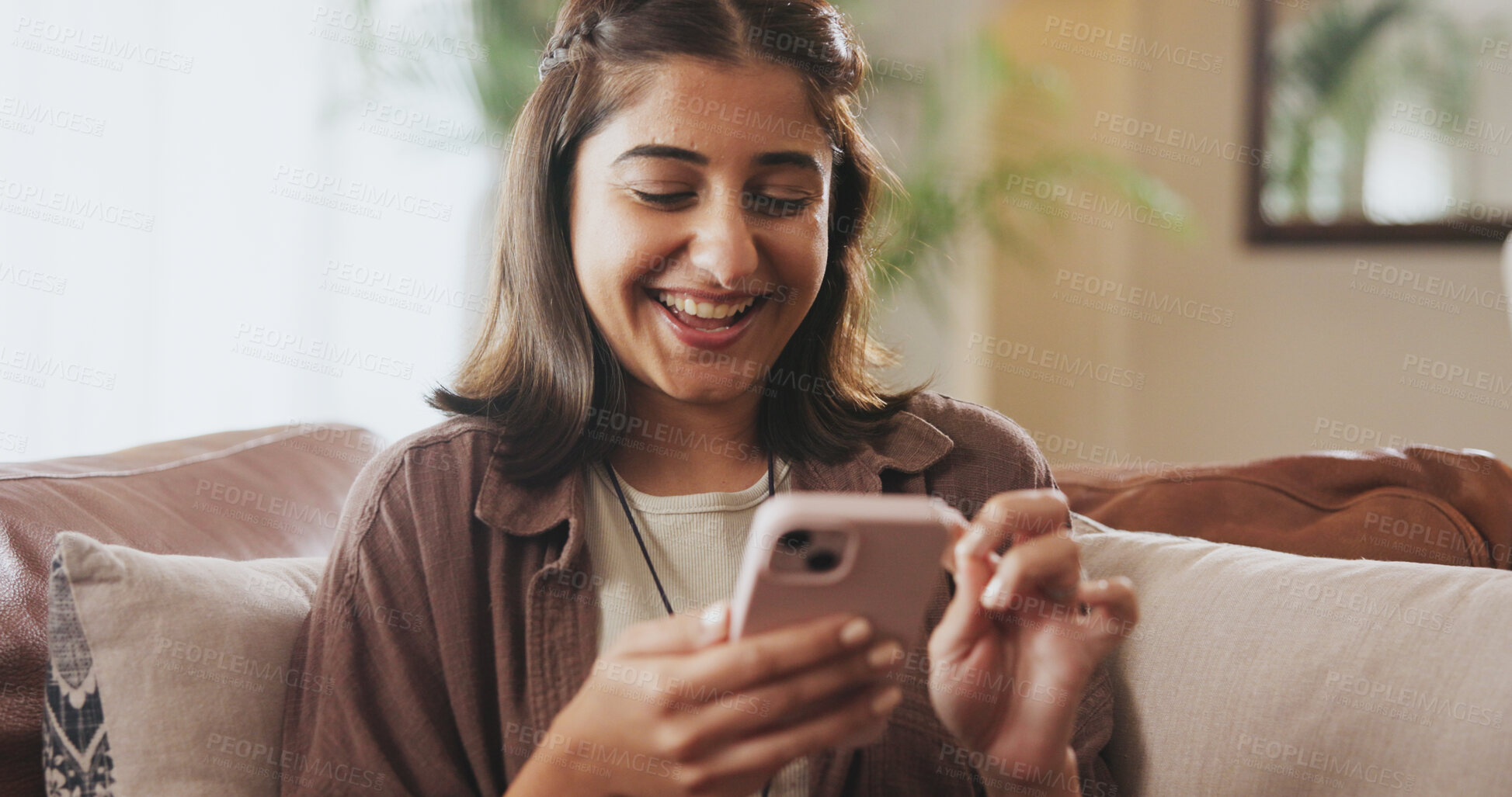 Buy stock photo Happy, woman and smartphone on sofa for entertainment, communication or internet browsing in home. Female person, smile or excited with mobile tech on couch for streaming, research and social media