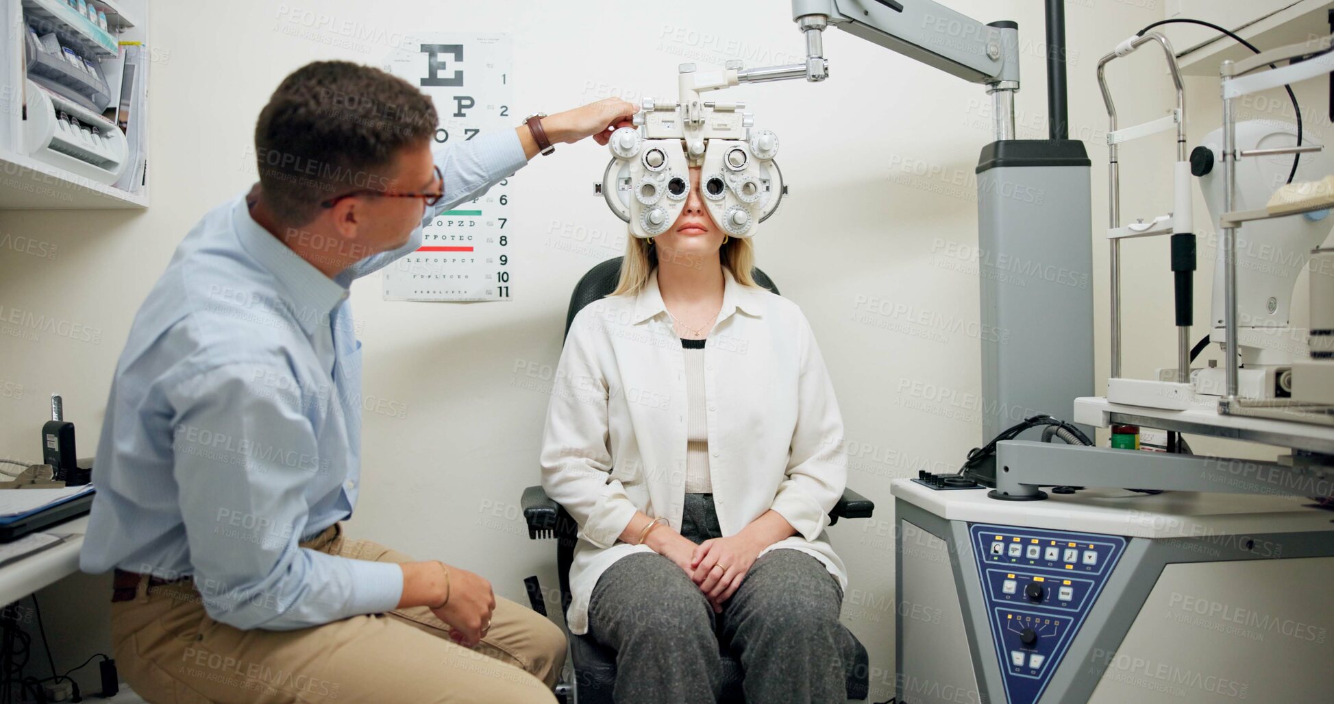 Buy stock photo Doctor, ophthalmologist and woman on phoropter for eye care, consultation or health exam in clinic. Optometry, test or patient on lens machine tools for vision check, wellness and eyesight correction