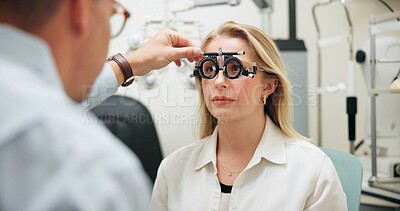 Buy stock photo Doctor, optometry and woman with test frame for eye care, consultation and exam in clinic. Ophthalmologist, trail and patient on lens for wellness, vision check and healthcare for eyesight correction