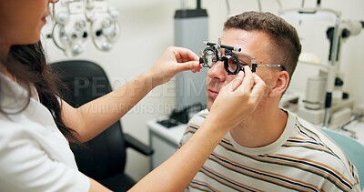 Buy stock photo Optometrist, patient and assessment in clinic for eye exam, optometry and vision with phoropter. Specialist, man and testing machine in hospital for wellness, healthcare or ophthalmology for glaucoma