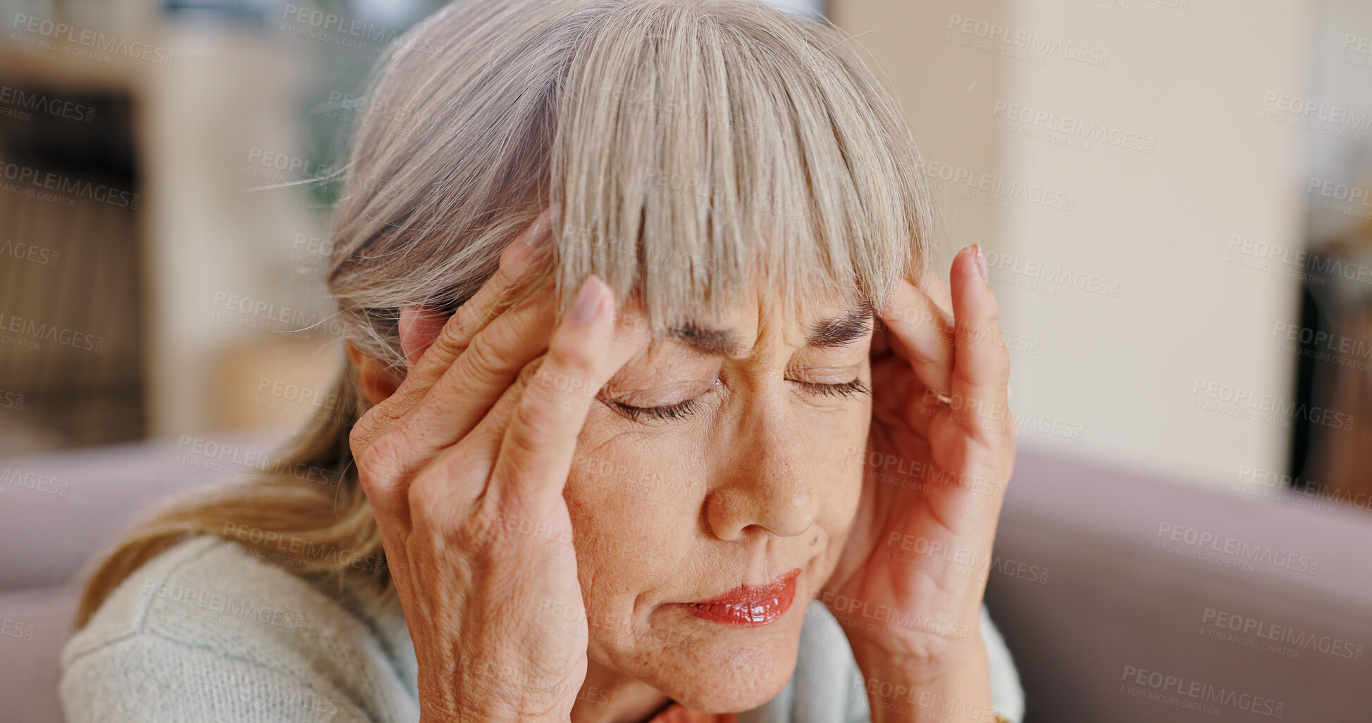 Buy stock photo Senior woman, lonely and depressed in lounge, hand and memory of past, retirement and sad in nursing home. Grandma, widow and couch of house, remember and elderly person in living room and grief