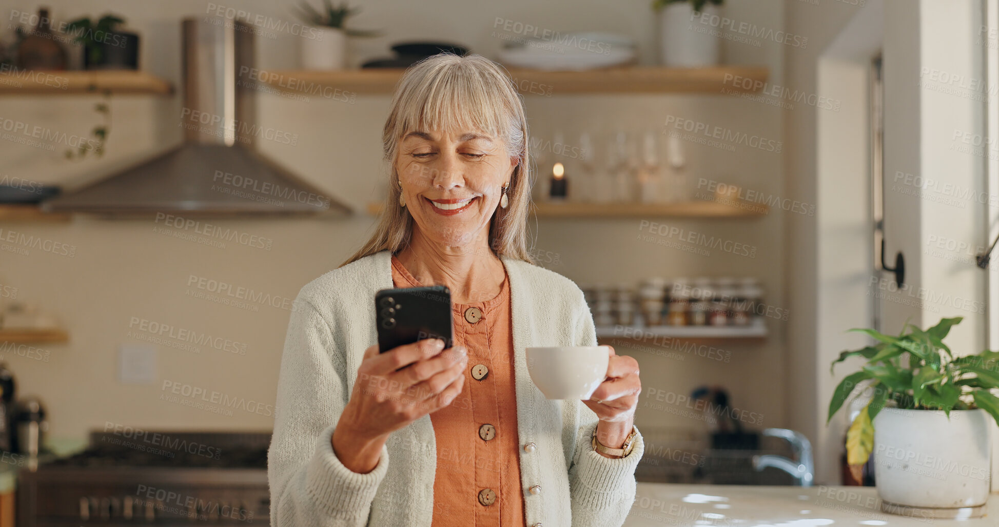 Buy stock photo Home, coffee and senior woman with phone for online, communication and learning with beverage. House, smile and elderly person with smartphone for internet media, information and reading morning news