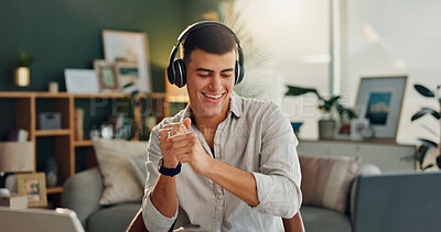 Buy stock photo Home, dance and man with music in headphones for online audio, entertainment or listening to radio. Happy, male person and technology with energy on chair for sound, streaming service or subscription