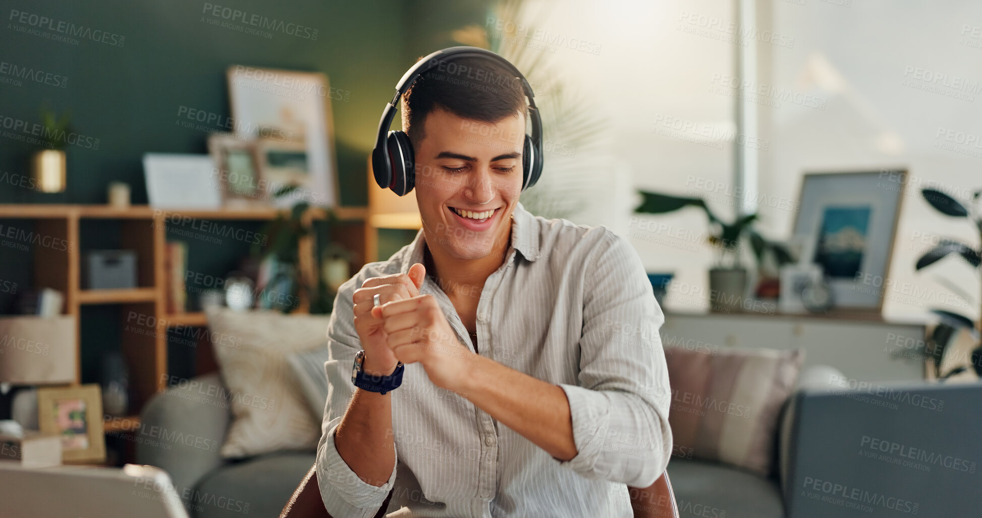 Buy stock photo Home, dance and man with music in headphones for online audio, entertainment or listening to radio. Happy, male person and technology with energy on chair for sound, streaming service or subscription