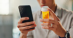 Home, pills and hands of man with phone for internet research, medical app and reading medication label. Male person, prescription drugs and mobile with healthcare website for online faq and warning