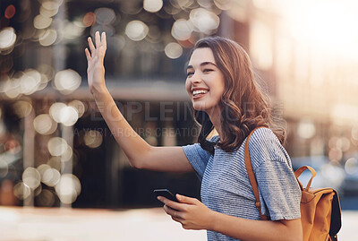 Buy stock photo Phone, smile and taxi with backpacker woman on street of city for commute, sightseeing or travel. App, hand gesture and transport with happy tourist person hailing cab or ride outdoor in urban town