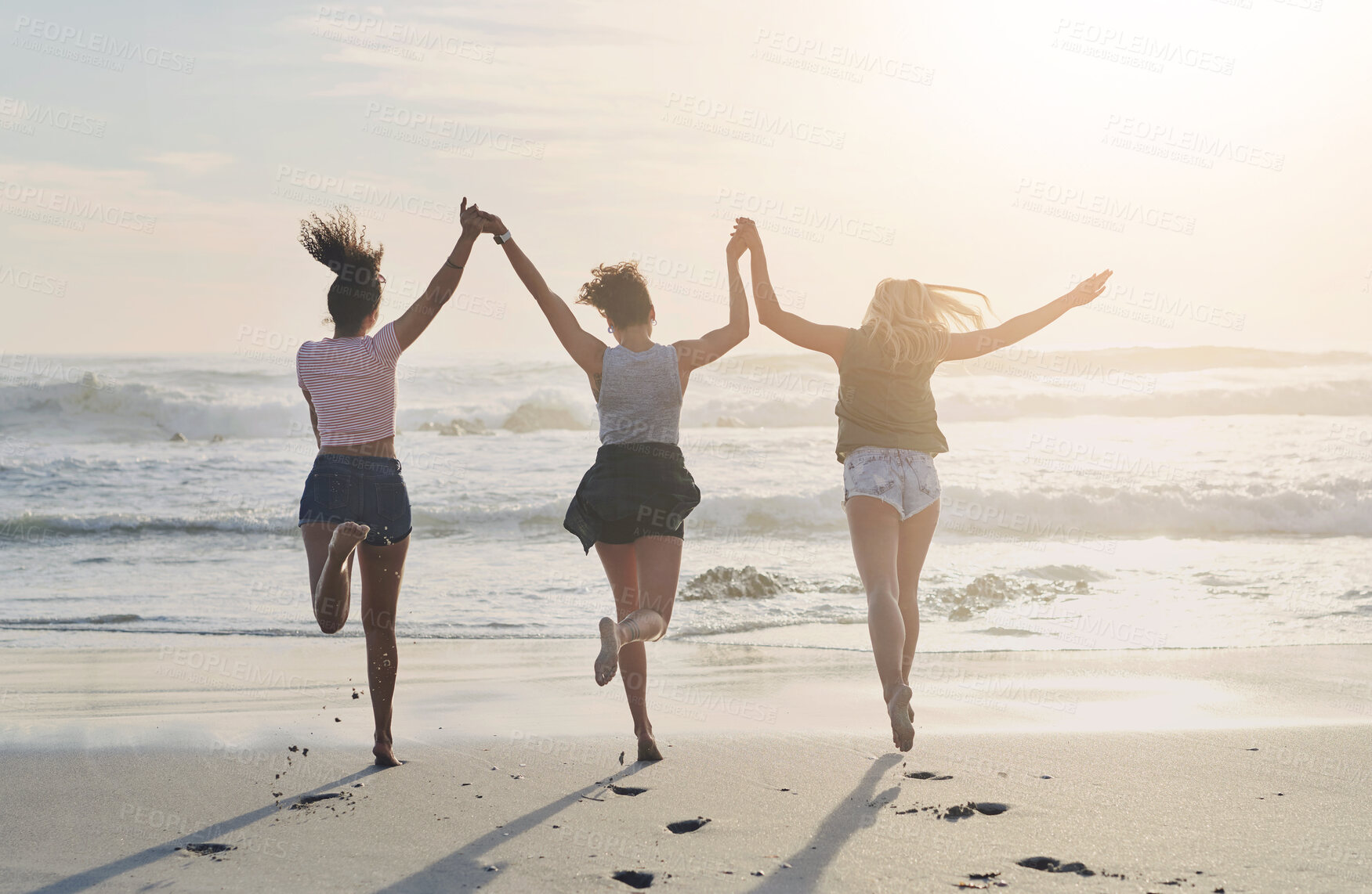 Buy stock photo Back, freedom and friends in beach for support, holding hands and bonding together on vacation in Miami. Sand, waves and group of women for travel, adventure and peace with fun for holiday in ocean