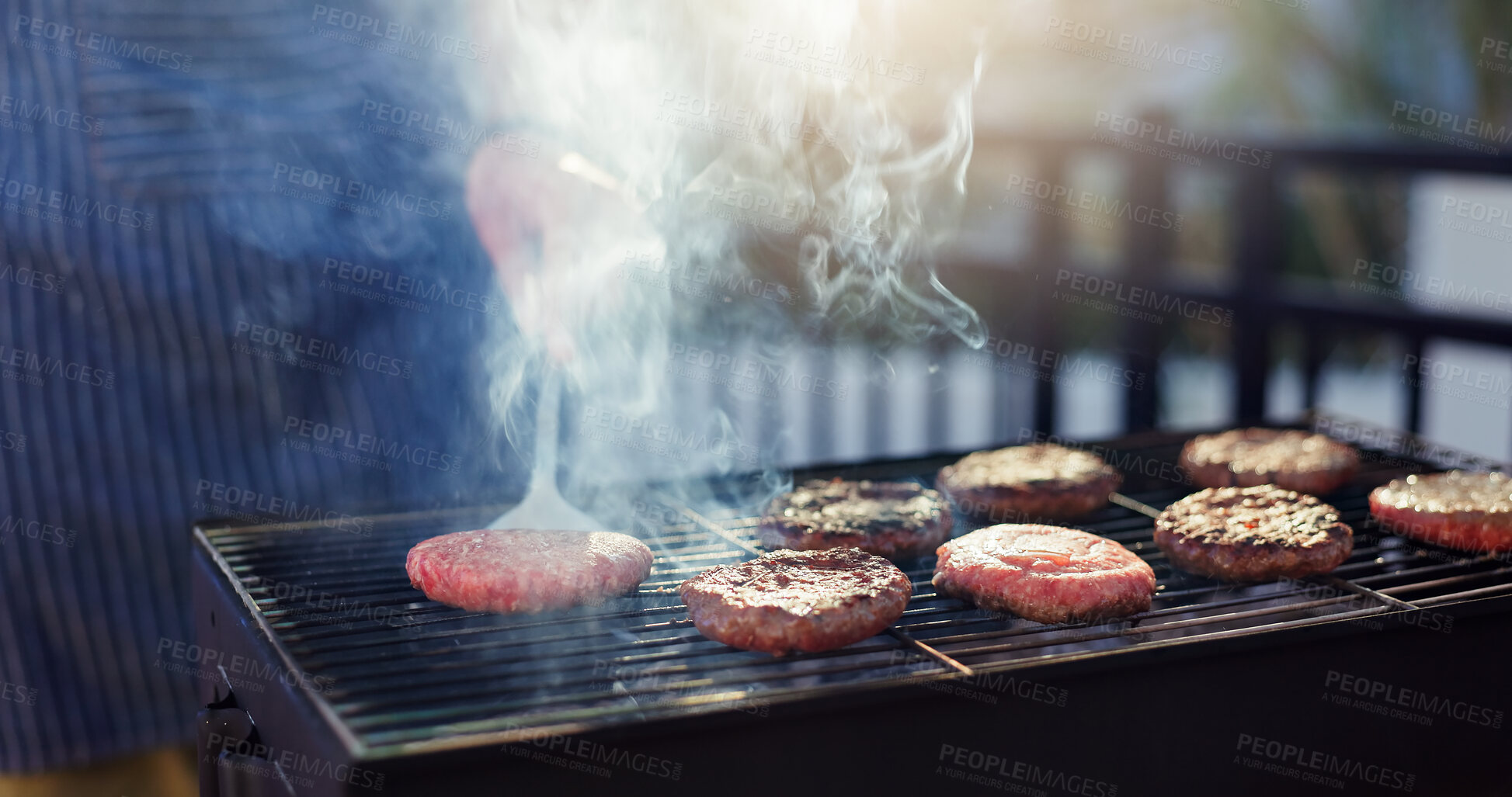 Buy stock photo Barbecue, party and man with burgers outdoor backyard for meal at reunion, social event or lunch on terrace. Grill, food and male person cooking patty, beef or meat for bbq dish on weekend at home.