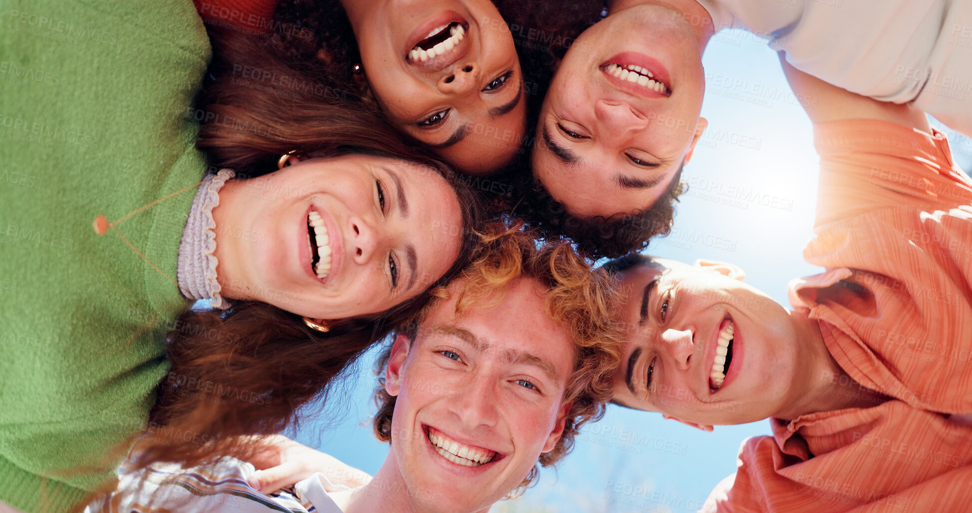 Buy stock photo Friends, people and portrait in huddle with low angle for team building, happy and solidarity outdoor. Group, face and smile with head together for partnership, unity and trust with collaboration