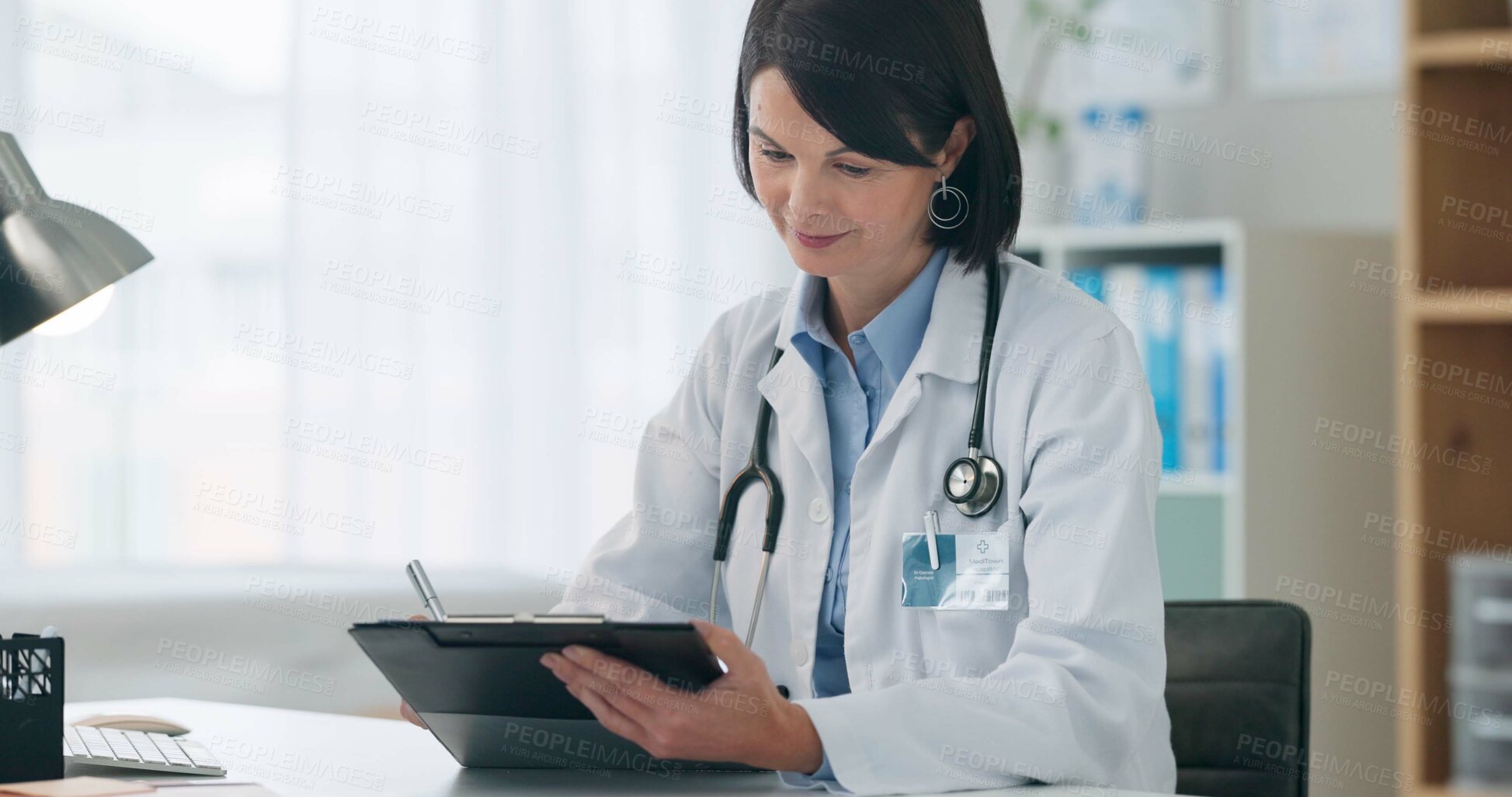 Buy stock photo Hospital, clipboard and woman doctor writing in office with medical, form and insurance, compliance or checklist. Healthcare, documents and surgeon with surgery notes, planning and checking schedule