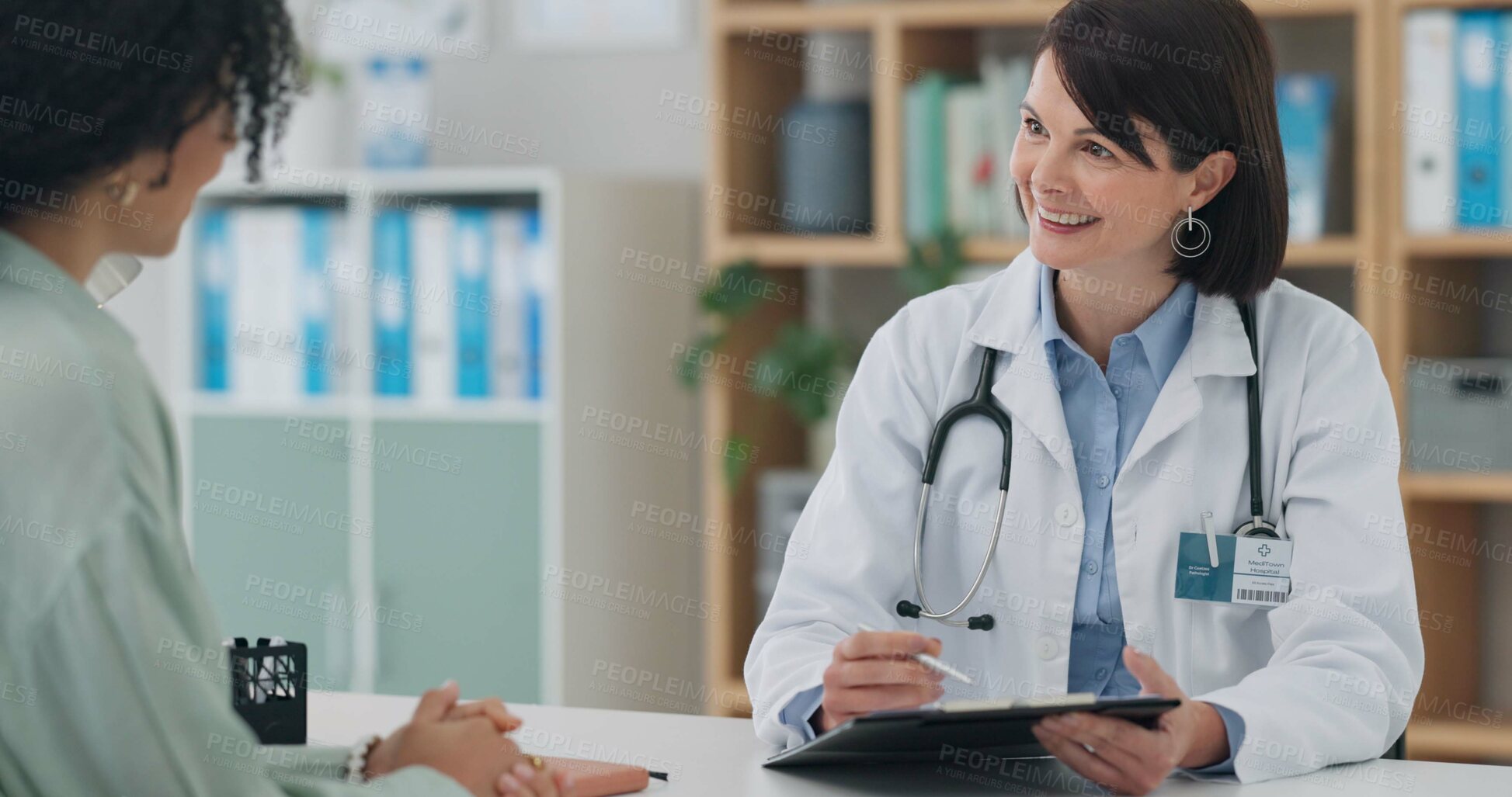 Buy stock photo Hospital, clipboard and woman consulting doctor in office for surgery, planning and treatment support. Healthcare, service or client with friendly surgeon for paper, checklist or insurance compliance