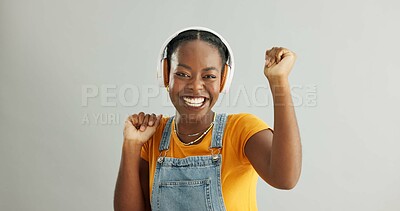 Buy stock photo Woman, headphones and happy dancing in studio, smile and radio track or song with energy or music on background. Streaming, sound and excited African female person, technology and podcast with model