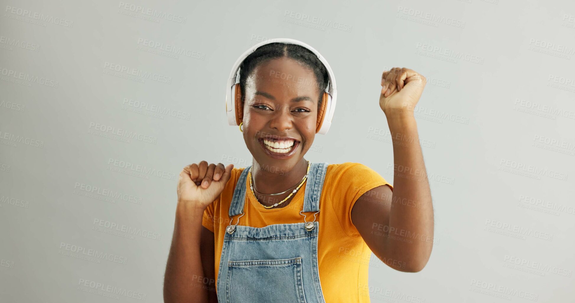 Buy stock photo Woman, headphones and happy dancing in studio, smile and radio track or song with energy or music on background. Streaming, sound and excited African female person, technology and podcast with model