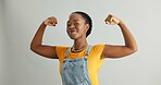 Happy, portrait and black woman flex in studio for achievement, satisfaction or celebration on gray background. Strength, victory and excited person for accomplishment, champion or winner with mockup