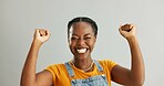 Black girl, happy and portrait with celebration in studio for winner, excited and victory bonus with joy. Woman, fist and success on white background with accomplishment, goal achievement and cheer.