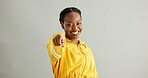 Portrait, smile and black woman in studio pointing to you for opportunity, decision or selection on gray background. Vote, winner and person with hand gesture for option, choice or invite on mockup
