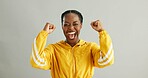 Black woman, happy and portrait with celebration in studio for winner, excited and victory bonus with joy. Girl, fist and success on white background with accomplishment, goal achievement and cheer.