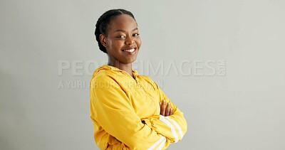 Buy stock photo Portrait, smile and black woman with arms crossed, fashion and confident model on grey studio background. African person, face or happy girl with casual clothing, pride and trendy with stylish outfit