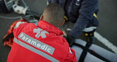 Buy stock photo People, uniform and paramedics with emergency, healthcare and patient with injury, victim and service. Staff, employees and medical with professional, save life and teamwork with equipment or outdoor