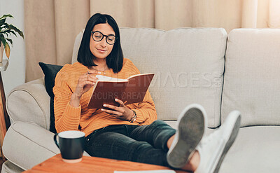 Buy stock photo Girl, reading book and relax in home, fiction and novel of literature for fantasy entertainment. Woman, glasses and chilling in living room with story to imagine, hobby and weekend with page on sofa