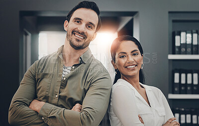 Buy stock photo Cropped shot of two young architects working together in a modern office