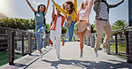 Group, students and people with jump at college, campus or happy for diversity, learning or development. Gen z friends. women and men in celebration, support or solidarity for education in university