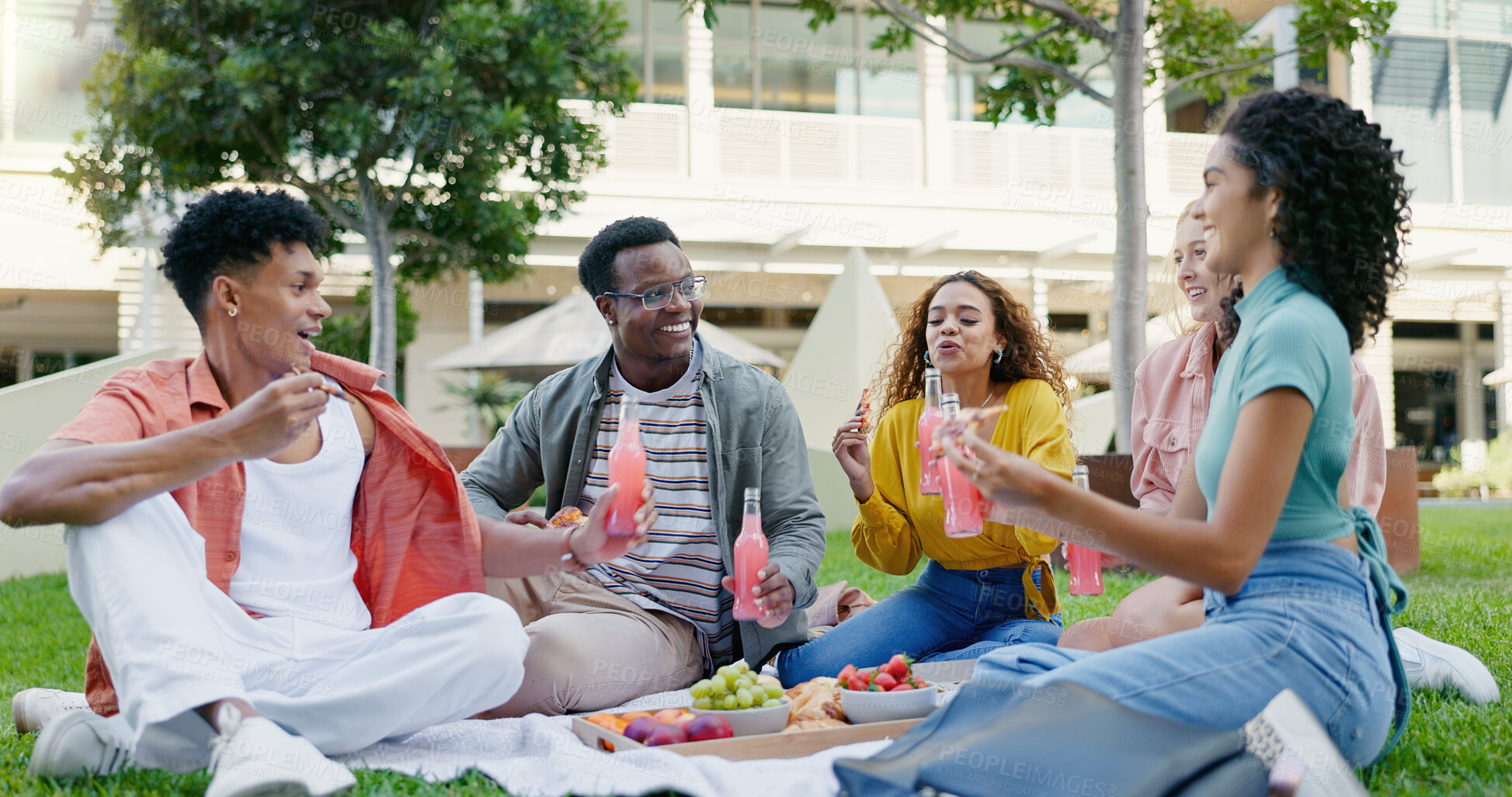 Buy stock photo Students, drinks and park with happy friends, diversity and picnic with smile in summer on campus. University, school and group with bonding and bottle on lawn of academy at college with Gen Z people