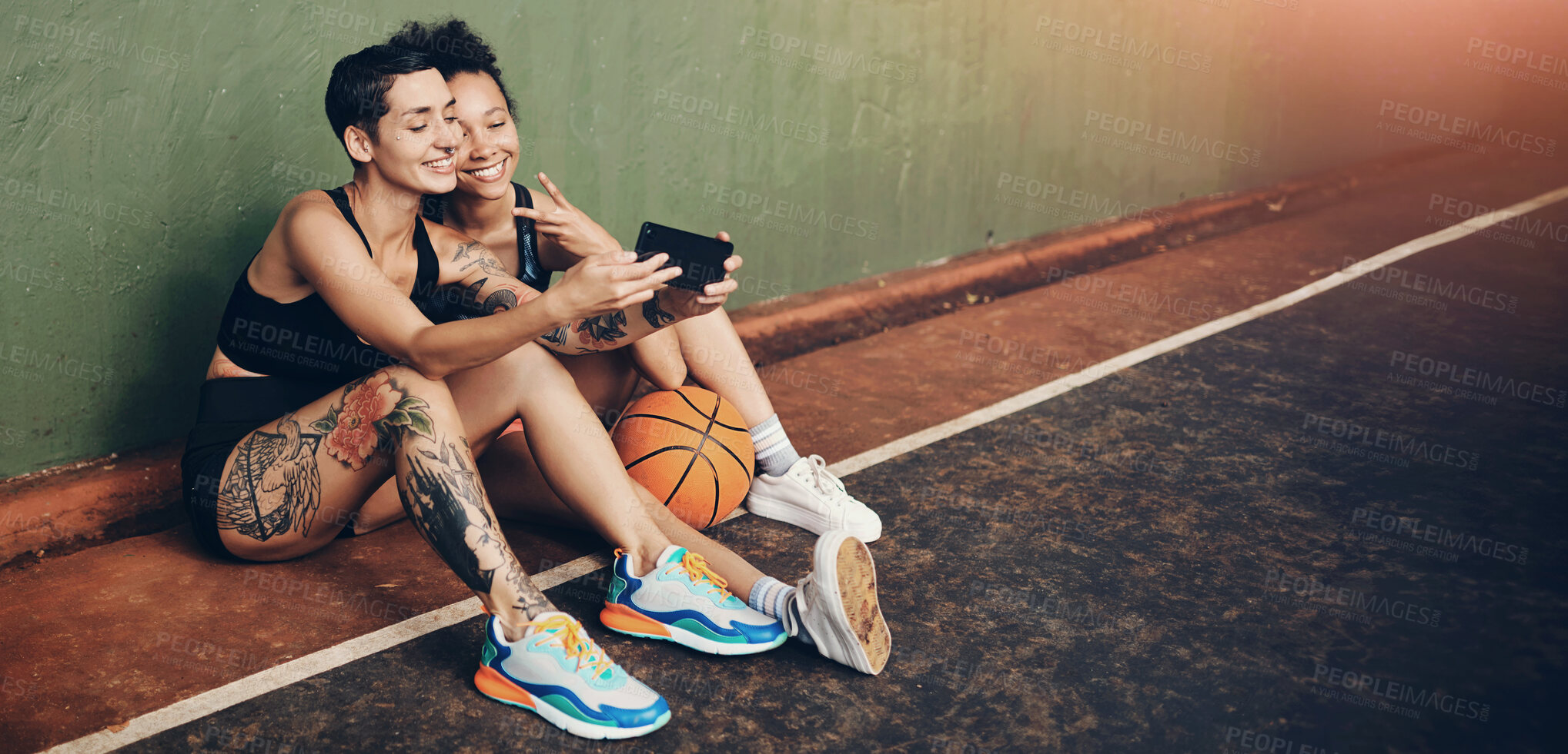 Buy stock photo Basketball, peace sign and outdoor selfie of women, fitness and sport ground for social media post. Emoji, people and court break for memory at club, online photography and athletes for tournament