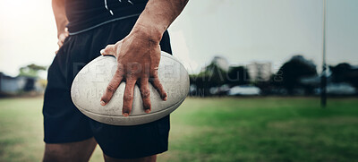 Buy stock photo Rugby, sports and hands of man with ball on field for training, tournament match and game. Closeup, athlete and player ready for exercise, workout and fitness for practice, performance or competition