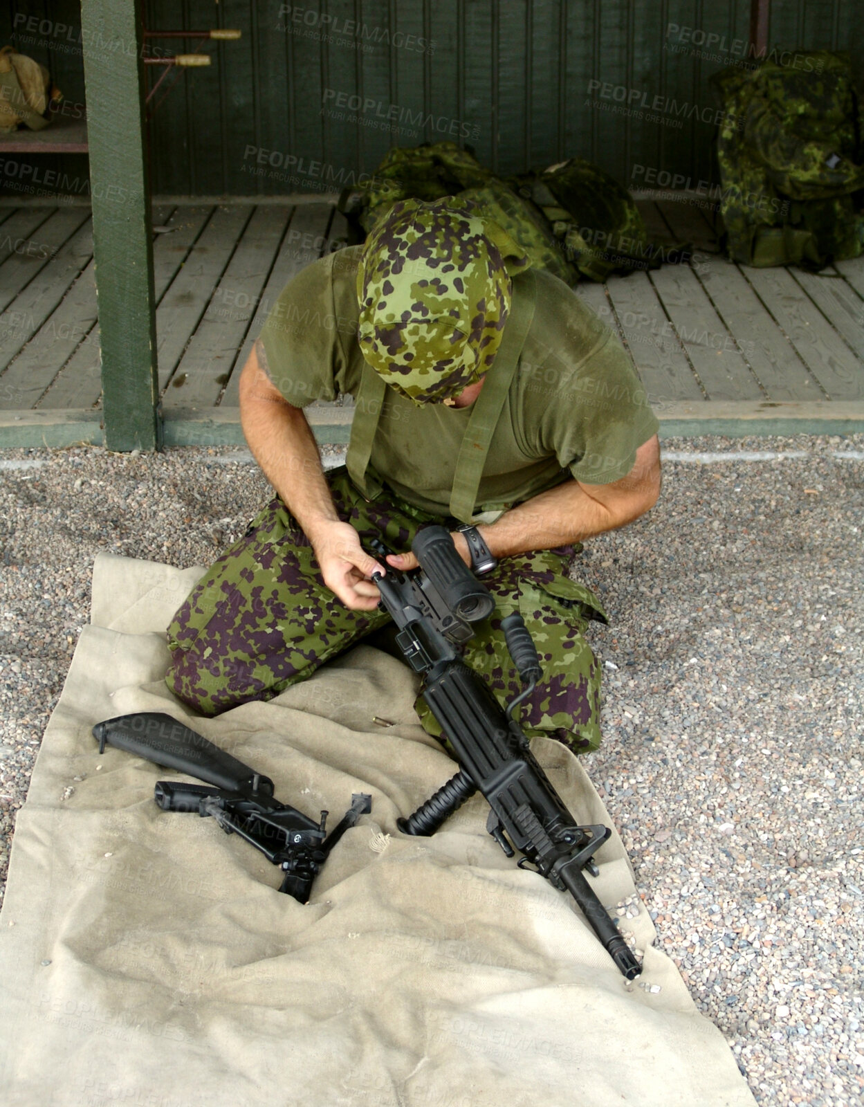 Buy stock photo Military, training to assemble a gun with a man soldier outdoor in camouflage uniform for an exercise. Army, blindfold and a trooper person at bootcamp to build a weapon or rifle in record time