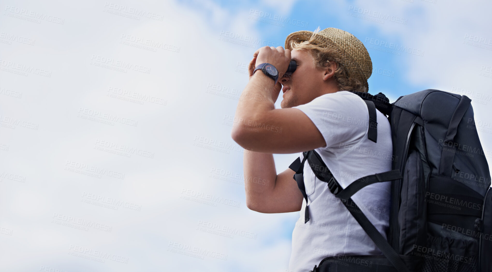 Buy stock photo Man, hiker and binoculars with backpack for hiking, sightseeing or outdoor travel with blue sky background. Male person, traveler or tourist with bag or optical instrument for view, vision or scope