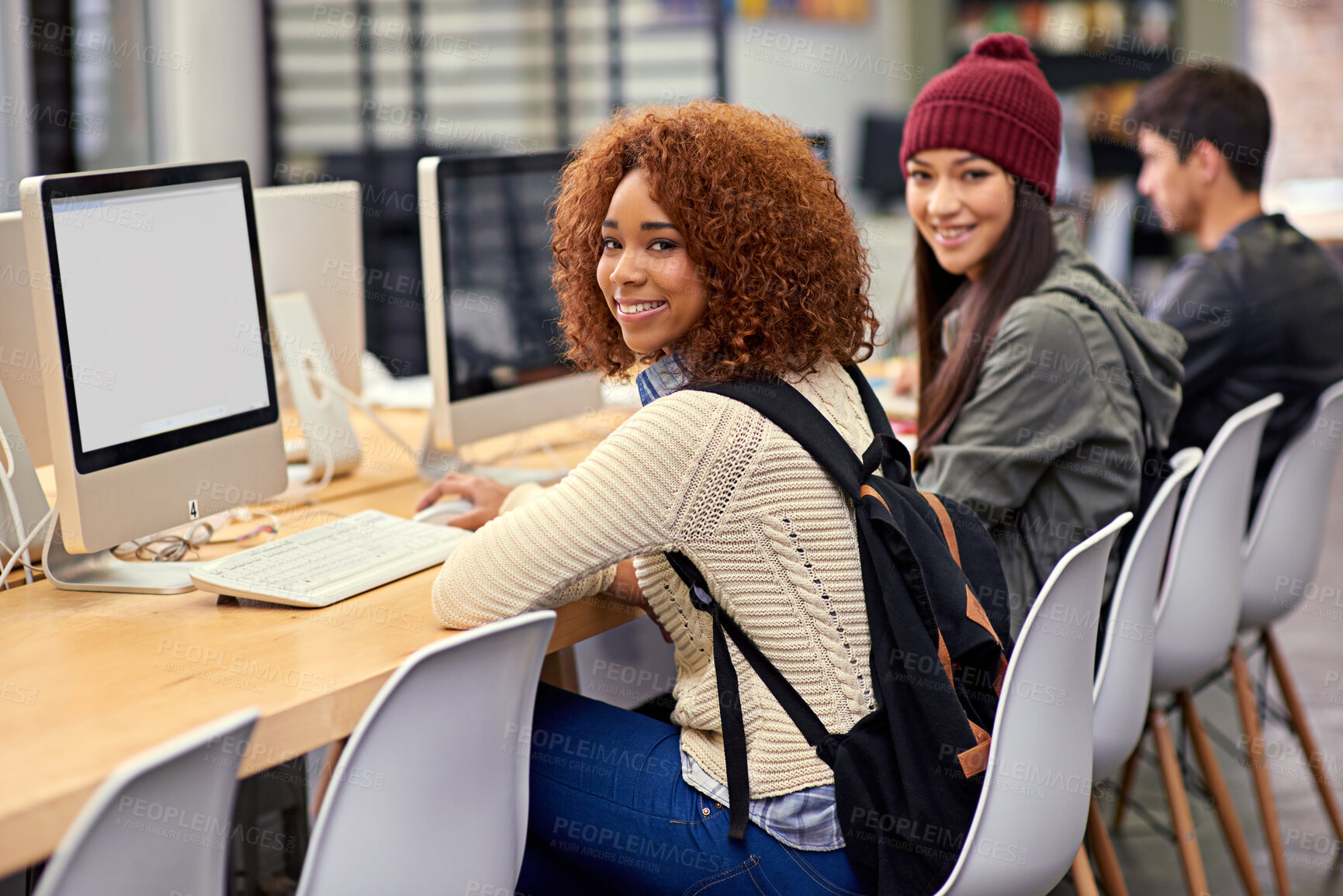 Buy stock photo Portrait, computer and students in library for research, studying and youth in university for knowledge. College, friends and girls with smile, typing and monitor for project, exam and scholarship