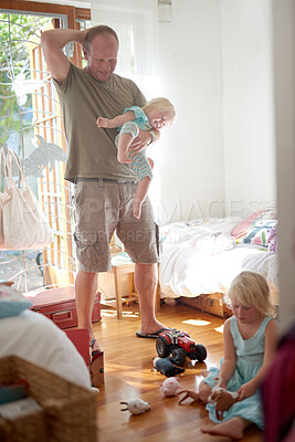 Buy stock photo Father, child and smile in home with stress or overwhelmed parenting for hyperactive adhd, siblings or development. Male person, daughters and laughing in bedroom as single dad, toys or housework