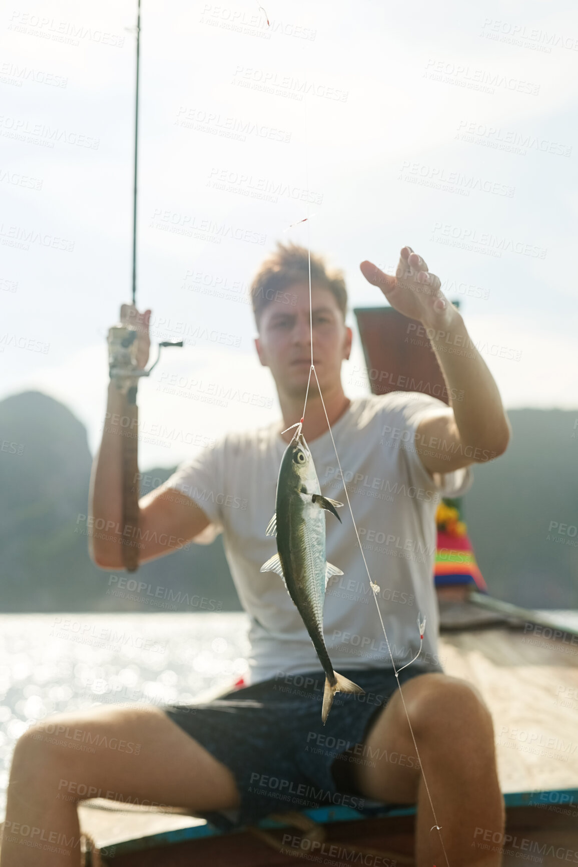 Buy stock photo Rod, fish and fisherman in boat by sea on adventure, weekend holiday and vacation in Thailand. Outdoor, ocean and guy with water mammal, animal and fishing as hobby or activity to relax in lake