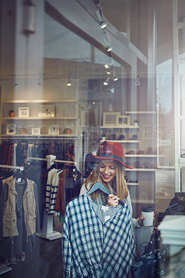 Buy stock photo Woman, customer and happy with blouse by boutique store window for shopping, sale and discount. Female shopper, fashion or person checking rack of clothes in fabric, material or retail shop at mall