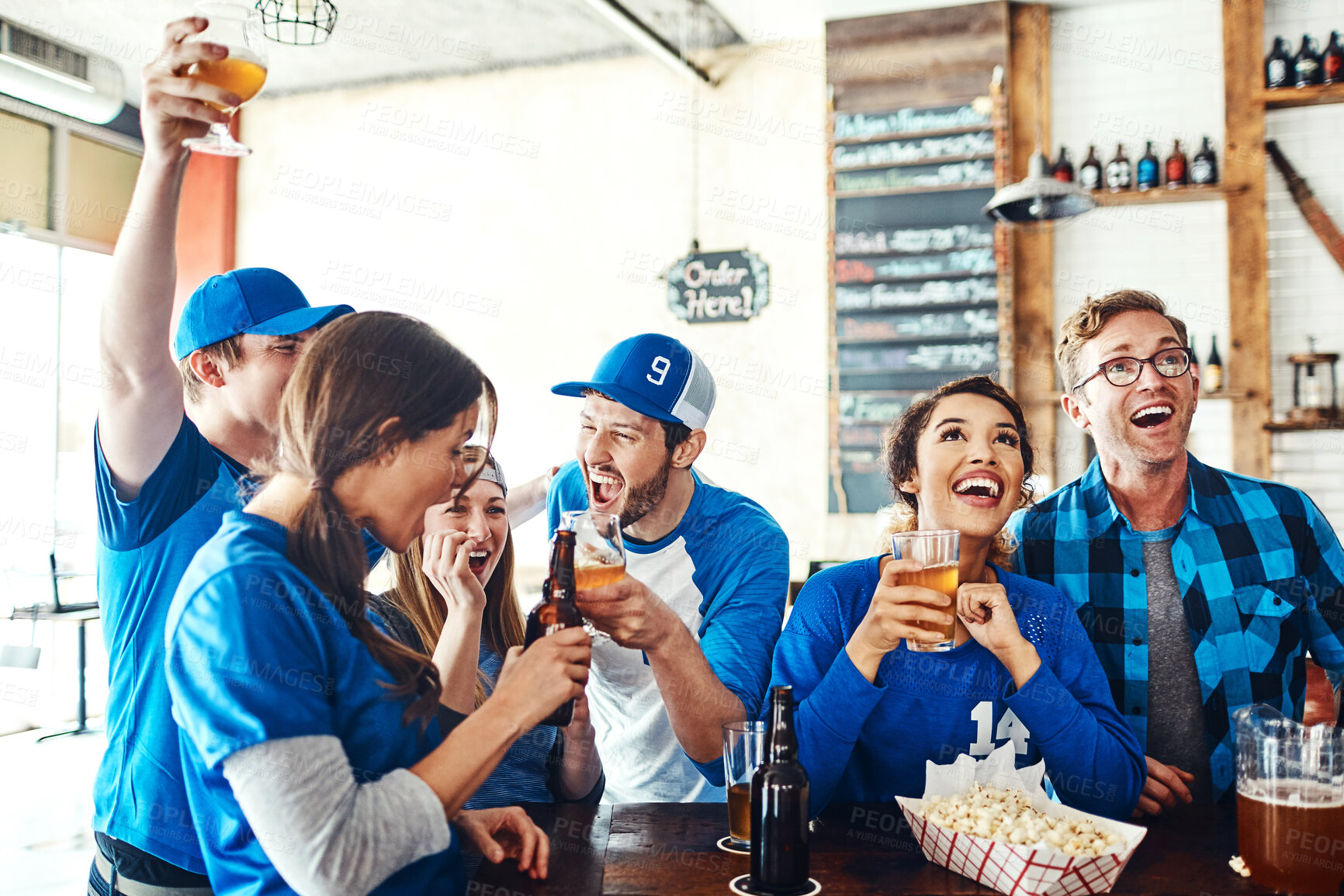 Buy stock photo Sports, fans and excited people in pub with beer, snacks or happy celebration of world cup together. Baseball, games and group of friends in bar for watch party, drinks and cheers of club competition