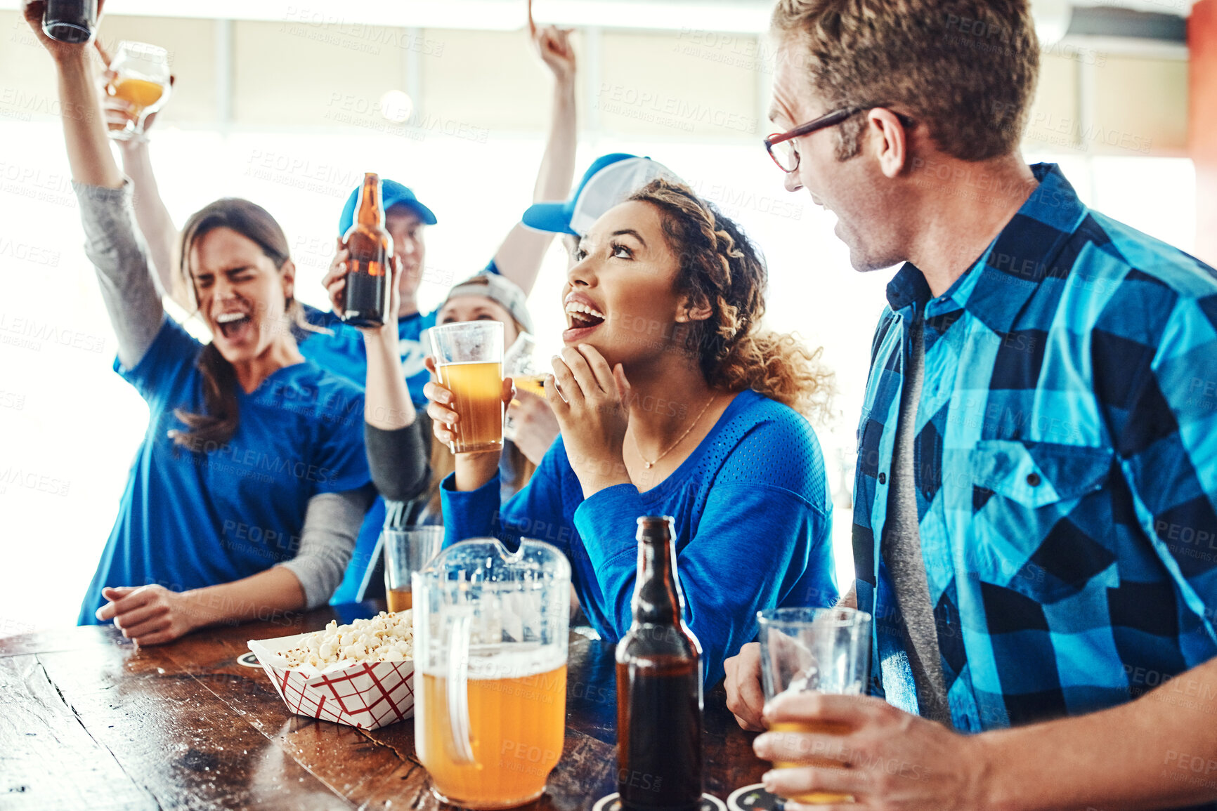 Buy stock photo Sports, men and women in bar with celebration, solidarity and fans with beer at broadcast of world cup. Baseball supporter, game and group of excited friends in pub for watch party, drinks and fun