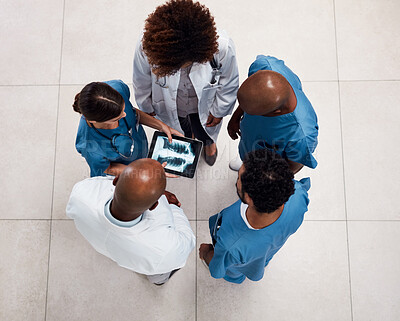 Buy stock photo Top view, doctors and employees with tablet screen, xray and teamwork for diagnosis in hospital. Wellness, medical and people with tech, advice and collaboration for healthcare, app or meeting