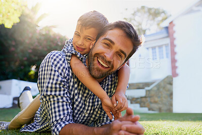 Buy stock photo Father, son and portrait in garden of home with hugging, smile and bonding together on grass. Happy people, dad and child with embrace in backyard of house for playing, relax or parenting outdoor