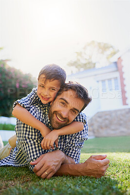 Buy stock photo Father, child and portrait in garden of home with hugging, smile and bonding together on grass. Happy people, dad and son with embrace in backyard of house for playing, relax and parenting outdoor