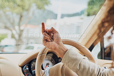 Buy stock photo Shot of an unrecognizable businesswoman showing someone the finger on her morning commute