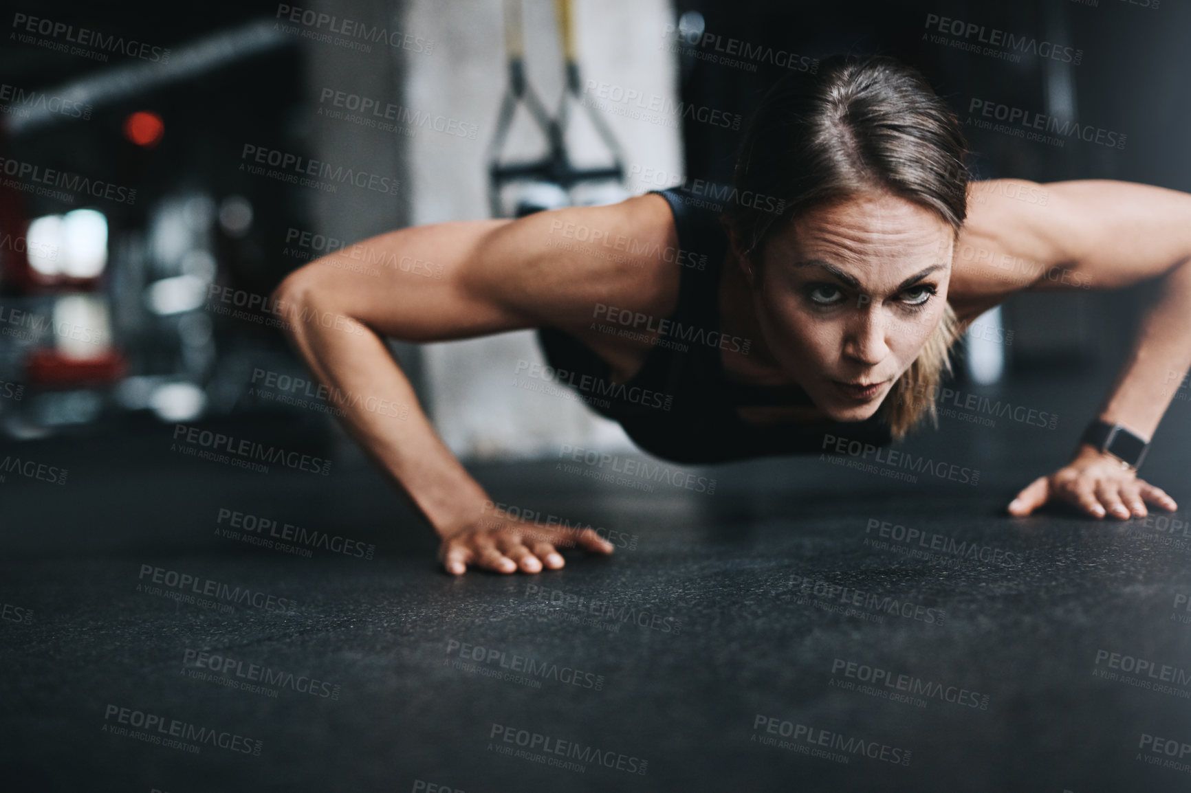 Buy stock photo Push ups, girl and fitness in gym on ground for workout, health and wellness with power or resilience. Plank, athlete and training in sports club for exercise, competition and body goals with muscle