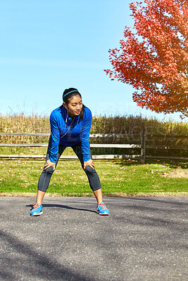 Buy stock photo Asian woman, running and tired with earphones for music rest or audio after workout or outdoor training in countryside. Female person or runner in recovery or breathing for cardio exercise in nature