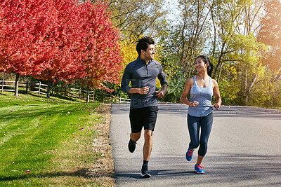 Buy stock photo Couple, running and fitness with energy, support and cardio with break, wellness and bonding together. Healthy people, outdoor and man with woman, runner or speed with training, challenge or exercise