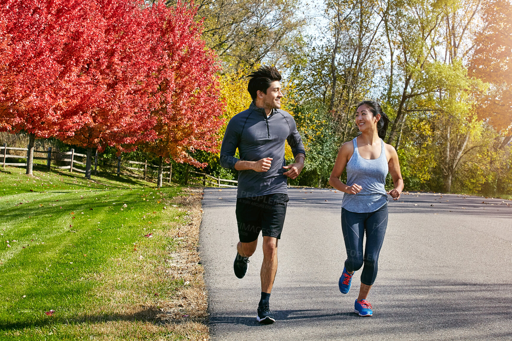 Buy stock photo Couple, running and fitness with energy, support and cardio with break, wellness and bonding together. Healthy people, outdoor and man with woman, runner or speed with training, challenge or exercise