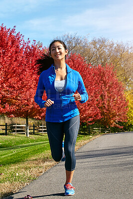 Buy stock photo Asian woman, running and wellness with cardio, exercise and challenge with endurance, nature and hobby. Healthy person, outdoor and runner with fitness, breathing and training with workout and smile