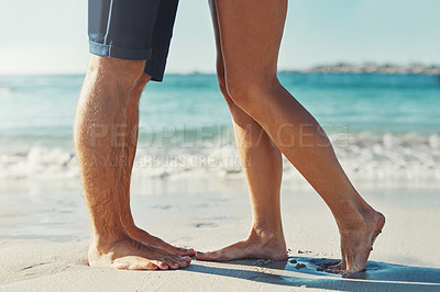 Buy stock photo Legs, people and couple by beach on holiday for love, bonding and care in Miami. Relationship, sand and feet by ocean or seaside for summer vacation, trip and travel for honeymoon and break