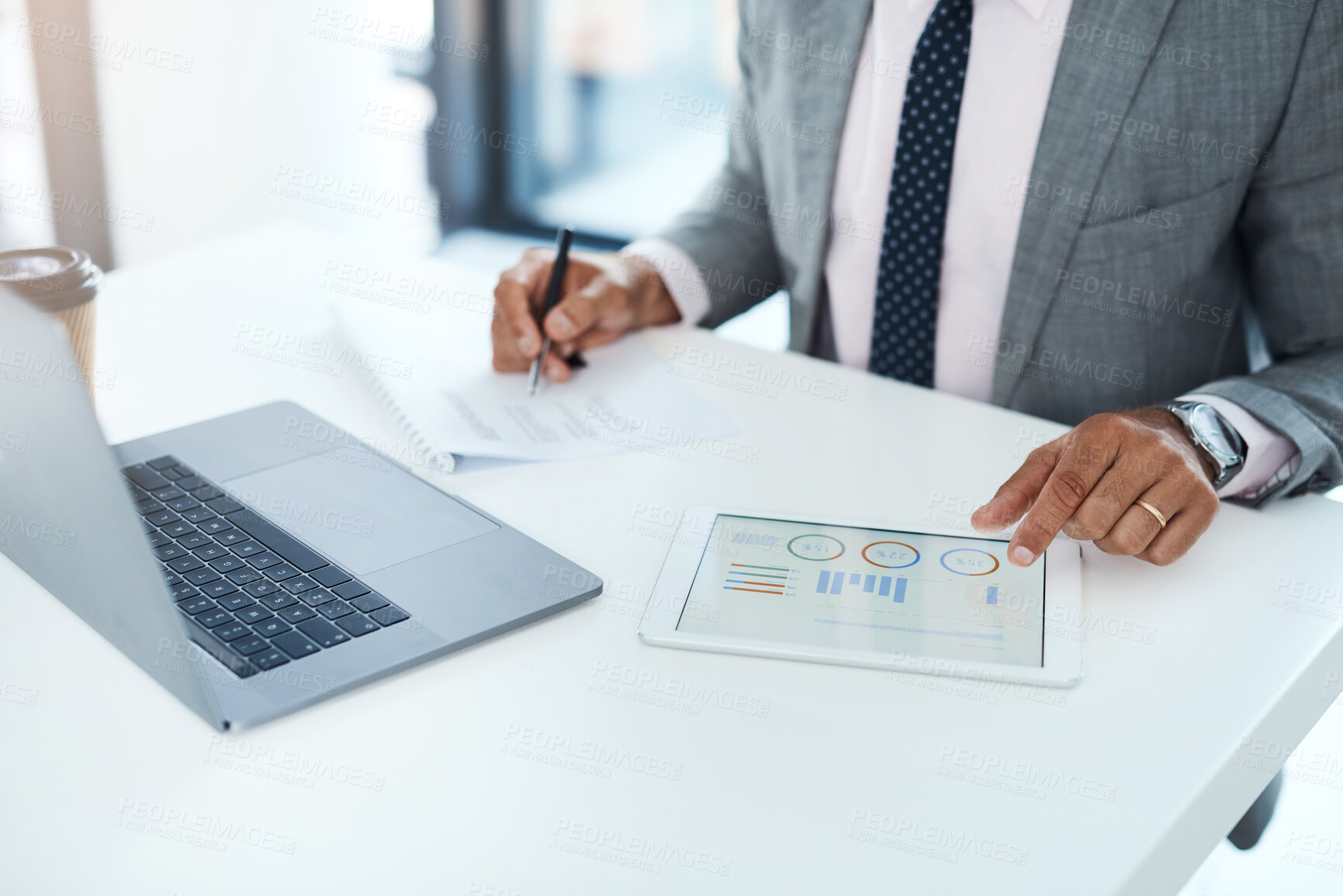 Buy stock photo Cropped shot of an unrecognizable businessman using a digital tablet